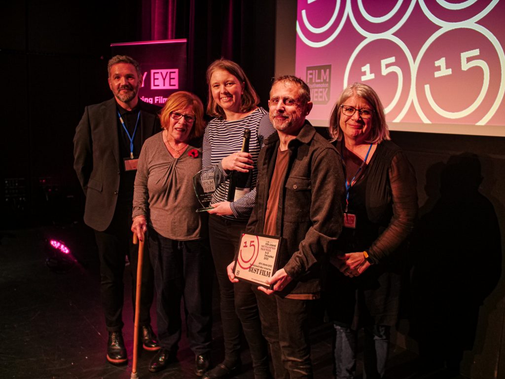 Lesley Fuller presenting the Michael Fuller Award for Best Film to Vicky Isley and Paul Smith, also pictured are Chair of City Eye Darren Kerr and Executive Director Susan Beckett