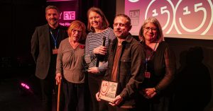 Lesley Fuller presenting the Michael Fuller Award for Best Film to Vicky Isley and Paul Smith, also pictured are Chair of City Eye Darren Kerr and Executive Director Susan Beckett